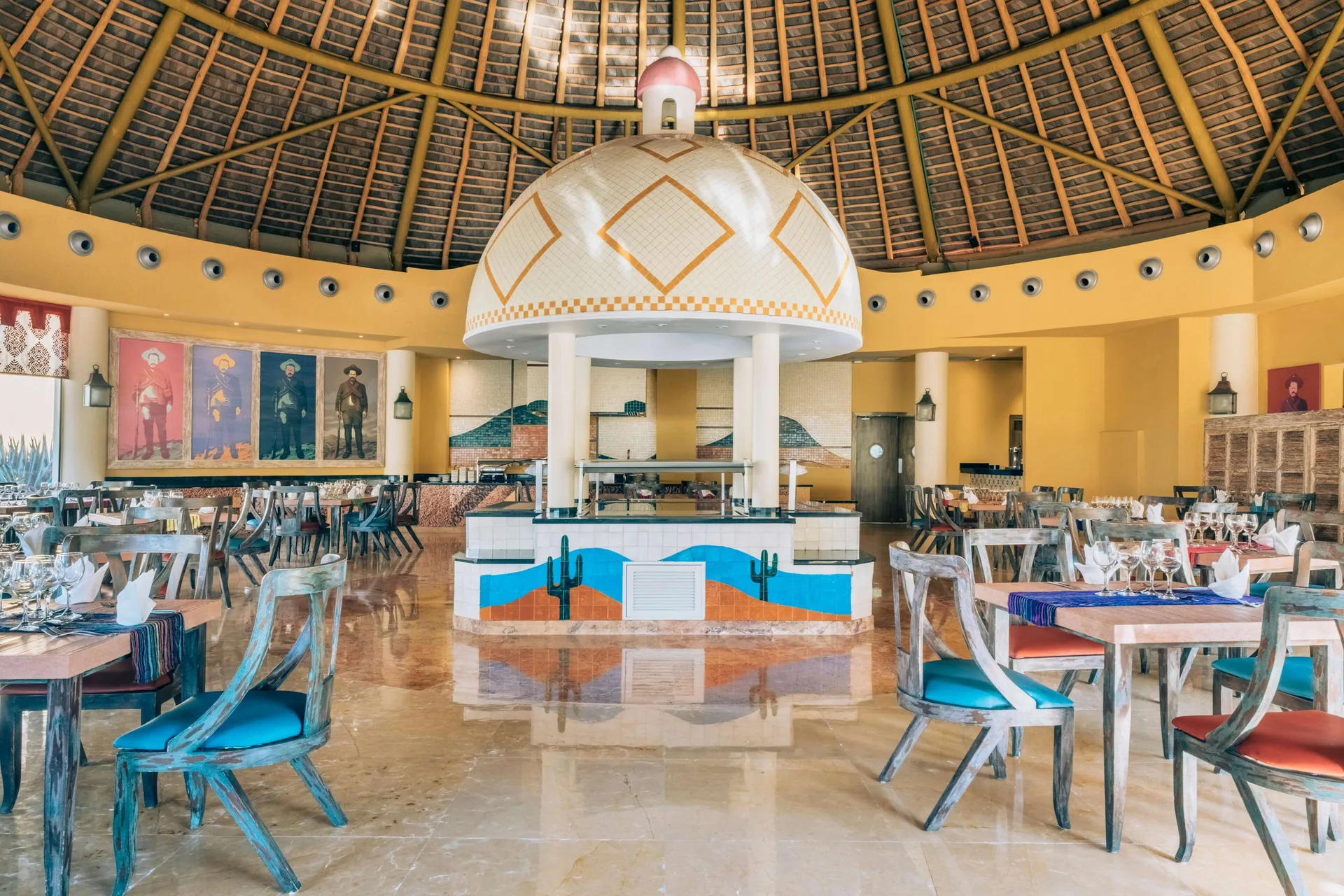 Colorful Mexican-style dining room under a palapa roof at Iberostar Selection Playa Mita.