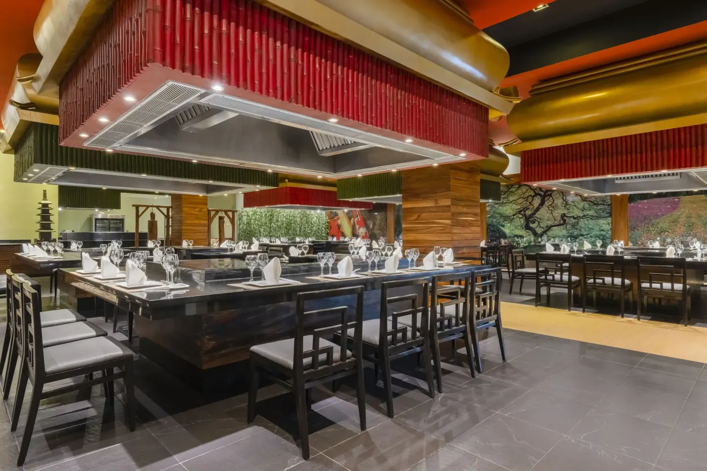 Japanese-style grill tables and red ceiling hoods at Iberostar Selection Playa Mita.
