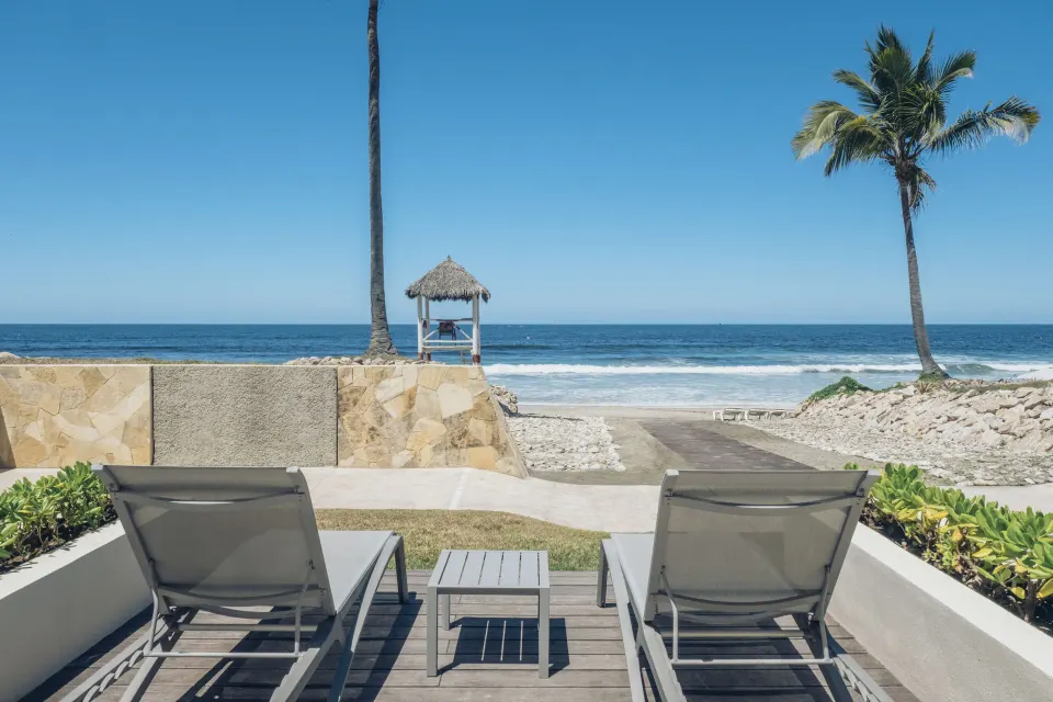Junior Suite beach access terrace with loungers facing the beach at Iberostar Selection Playa Mita.