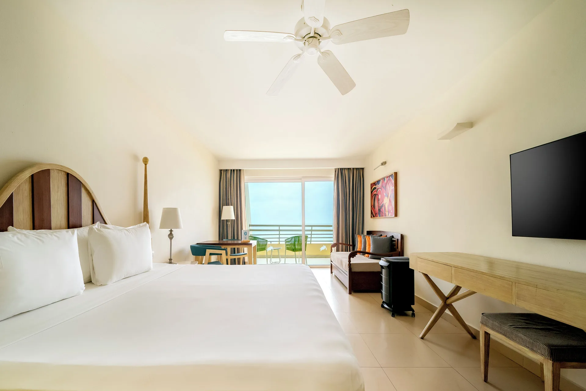 Junior Suite Oceanfront guest room with king bed and balcony at Iberostar Selection Playa Mita.