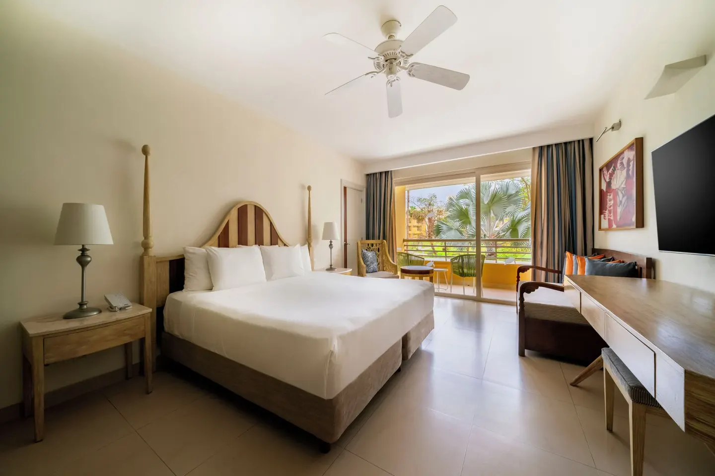 Premium Room with king bed, desk, seating, and balcony at Iberostar Selection Playa Mita.