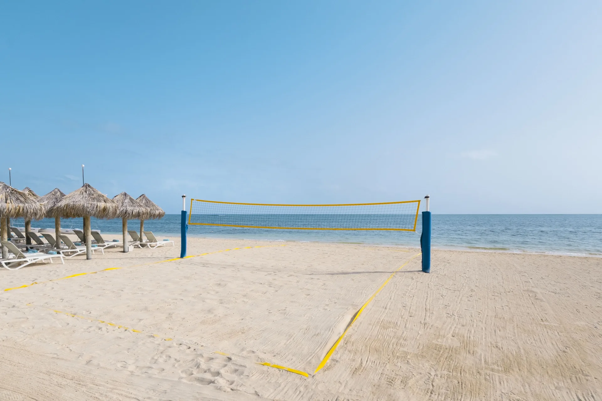 Beach volleyball court by the sea at Iberostar Selection Rose Hall Suites.