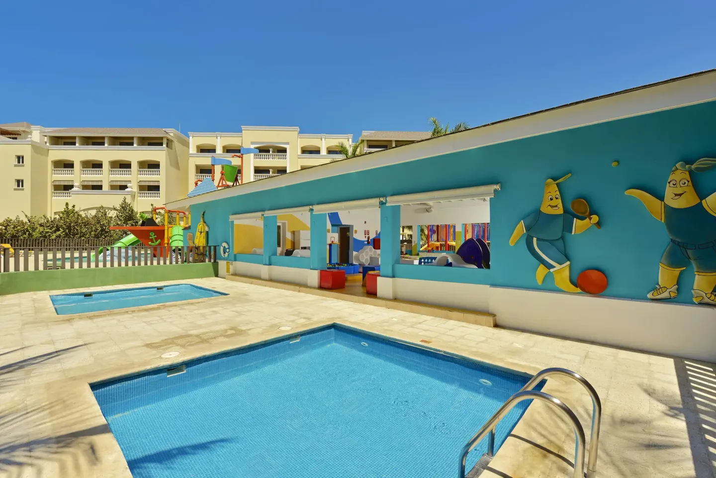 Children's pool area and colorful play building at Iberostar Selection Rose Hall Suites.