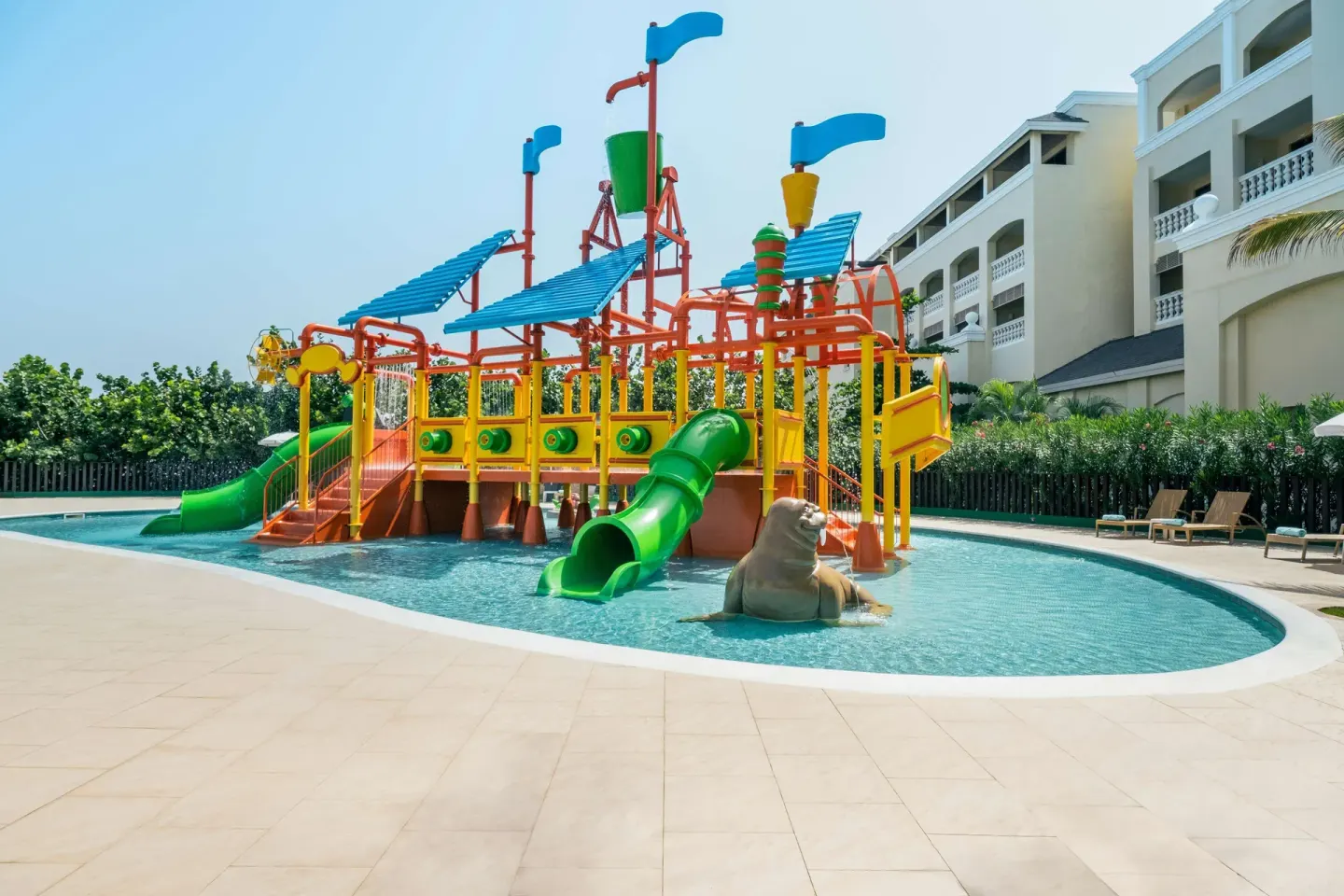 Kids' splash pool with slides and water features at Iberostar Selection Rose Hall Suites.