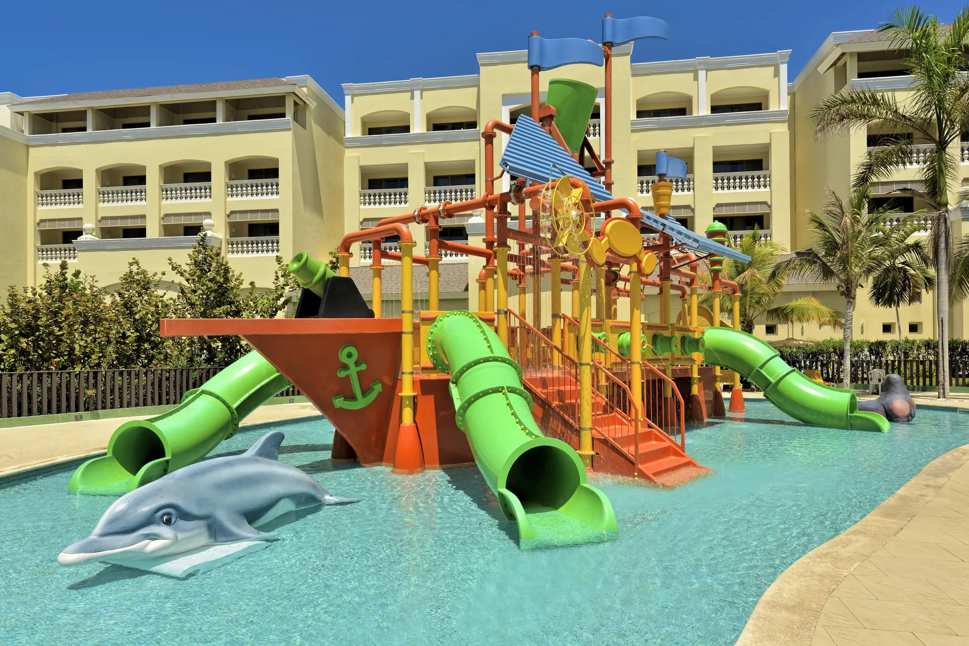 Kids' water play structure with slides at Iberostar Selection Rose Hall Suites.