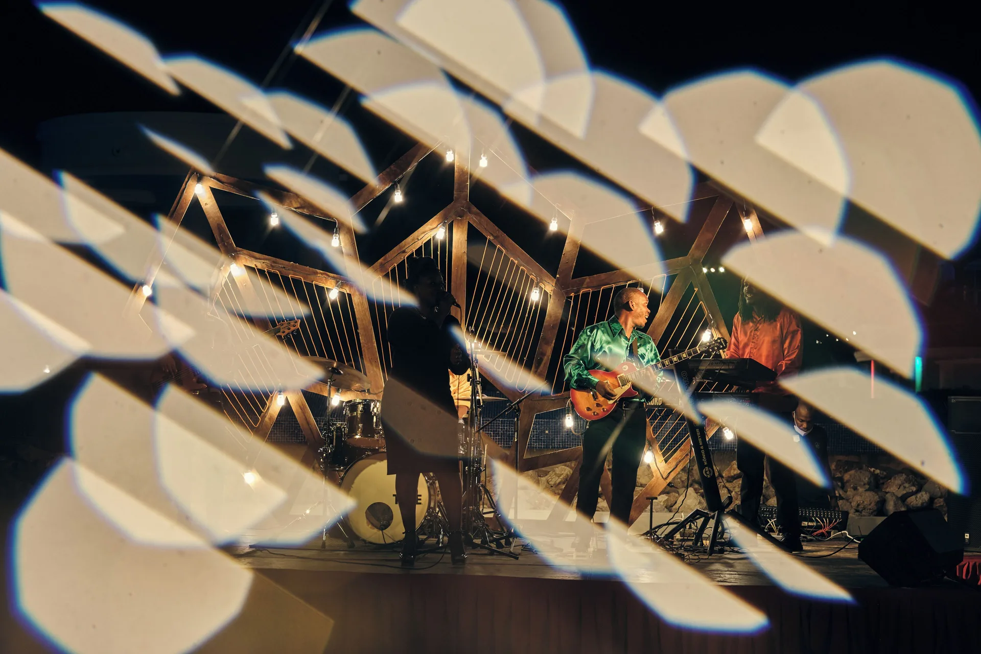 Live band performing on an outdoor stage at Iberostar Selection Rose Hall Suites.