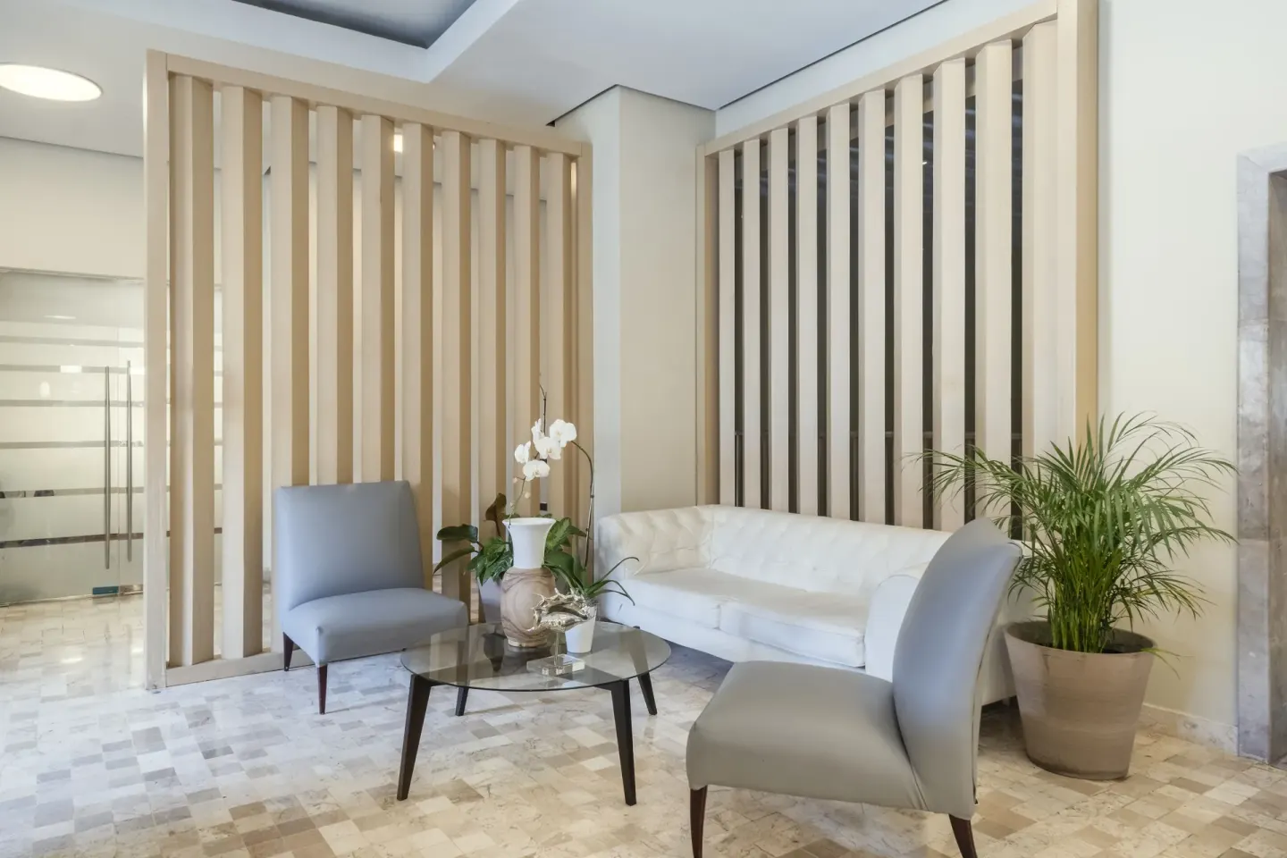 Spa lounge seating with plants at Iberostar Selection Rose Hall Suites.