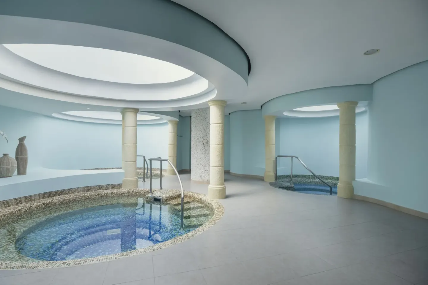 Spa pool area with tiled circular basins at Iberostar Selection Rose Hall Suites.