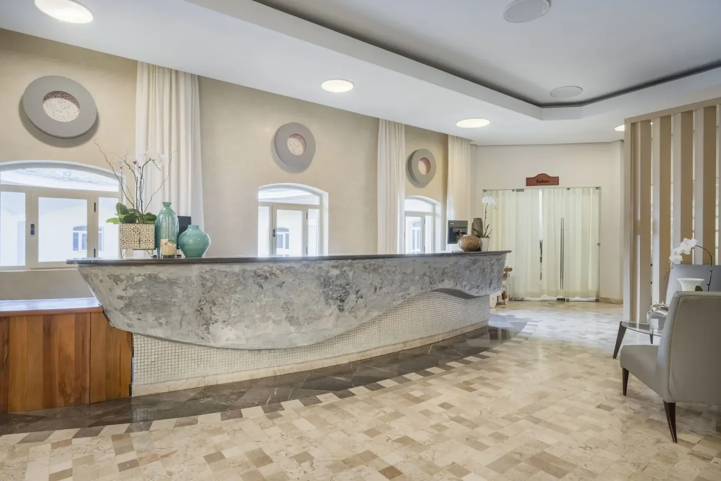 Spa reception desk and seating area at Iberostar Selection Rose Hall Suites.