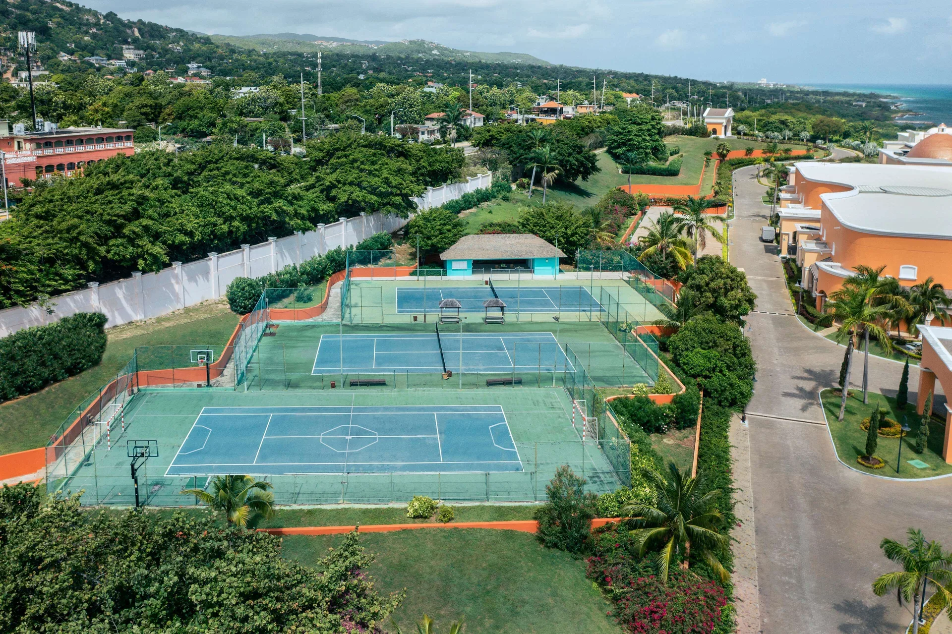 Sports courts and landscaped resort grounds at Iberostar Selection Rose Hall Suites.