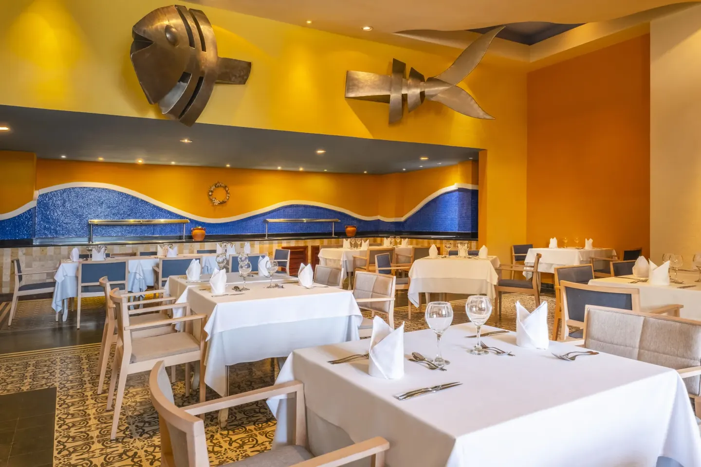 Nautical restaurant with fish sculptures at Iberostar Selection Rose Hall Suites.