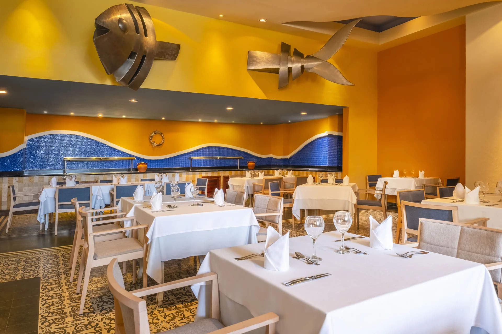 Nautical restaurant with fish sculptures at Iberostar Selection Rose Hall Suites.