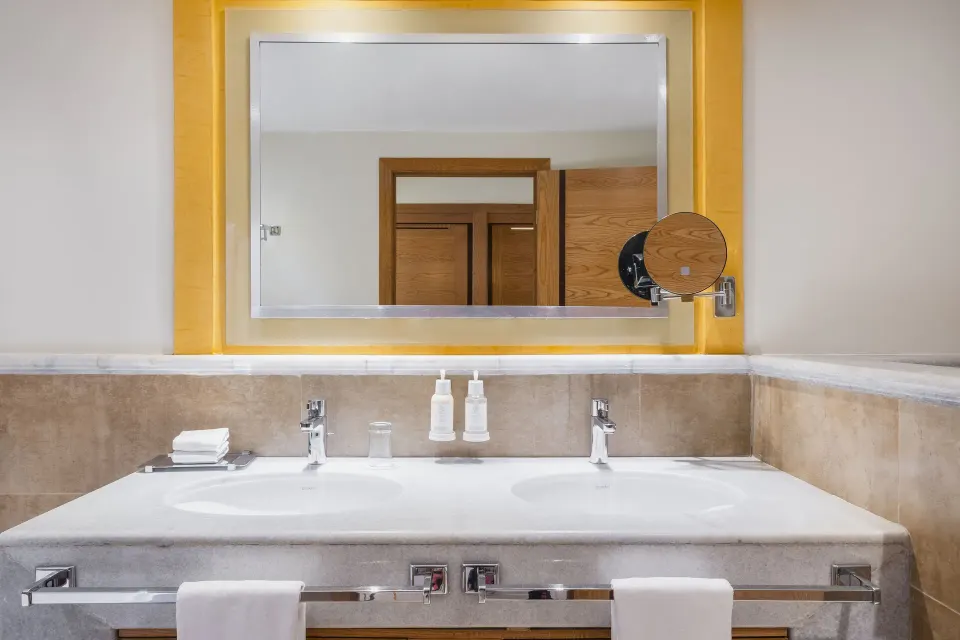 Junior Suite bathroom vanity with double sinks at Iberostar Selection Rose Hall Suites.