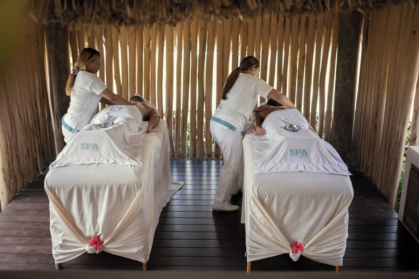 Couples massage setup in an open spa cabana at Iberostar Waves Costa Dorada.