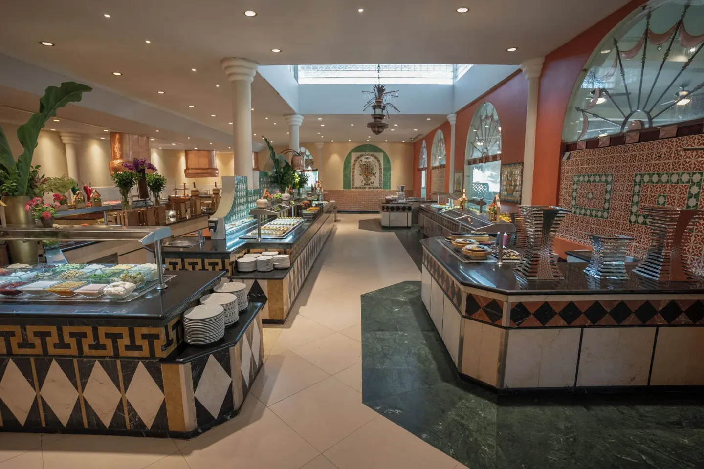 Buffet counters with colorful tilework at Iberostar Waves Costa Dorada.