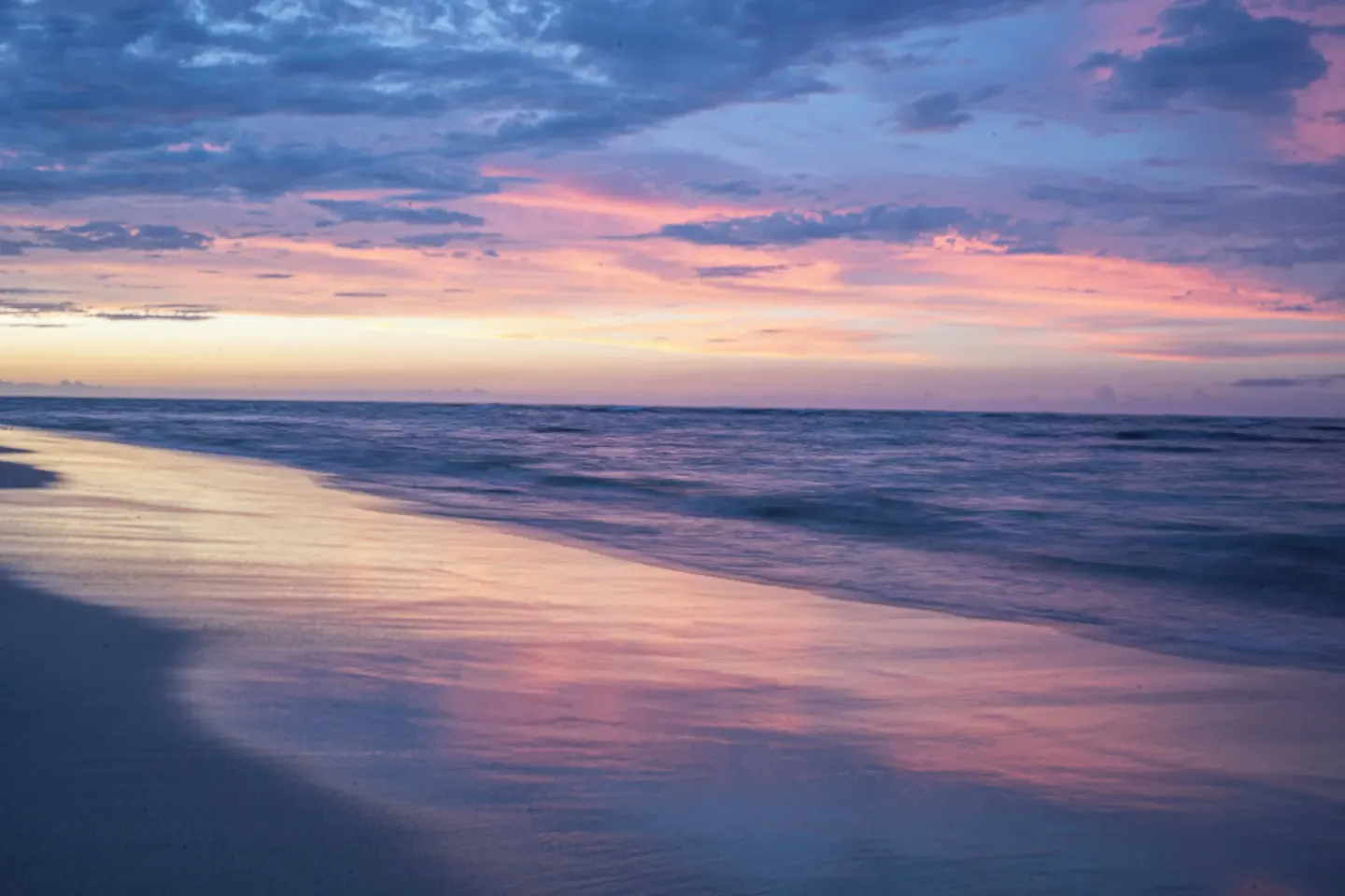 Oceanfront beach at sunset near Iberostar Waves Costa Dorada.