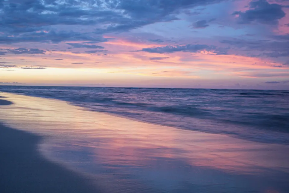Oceanfront beach at sunset near Iberostar Waves Costa Dorada.