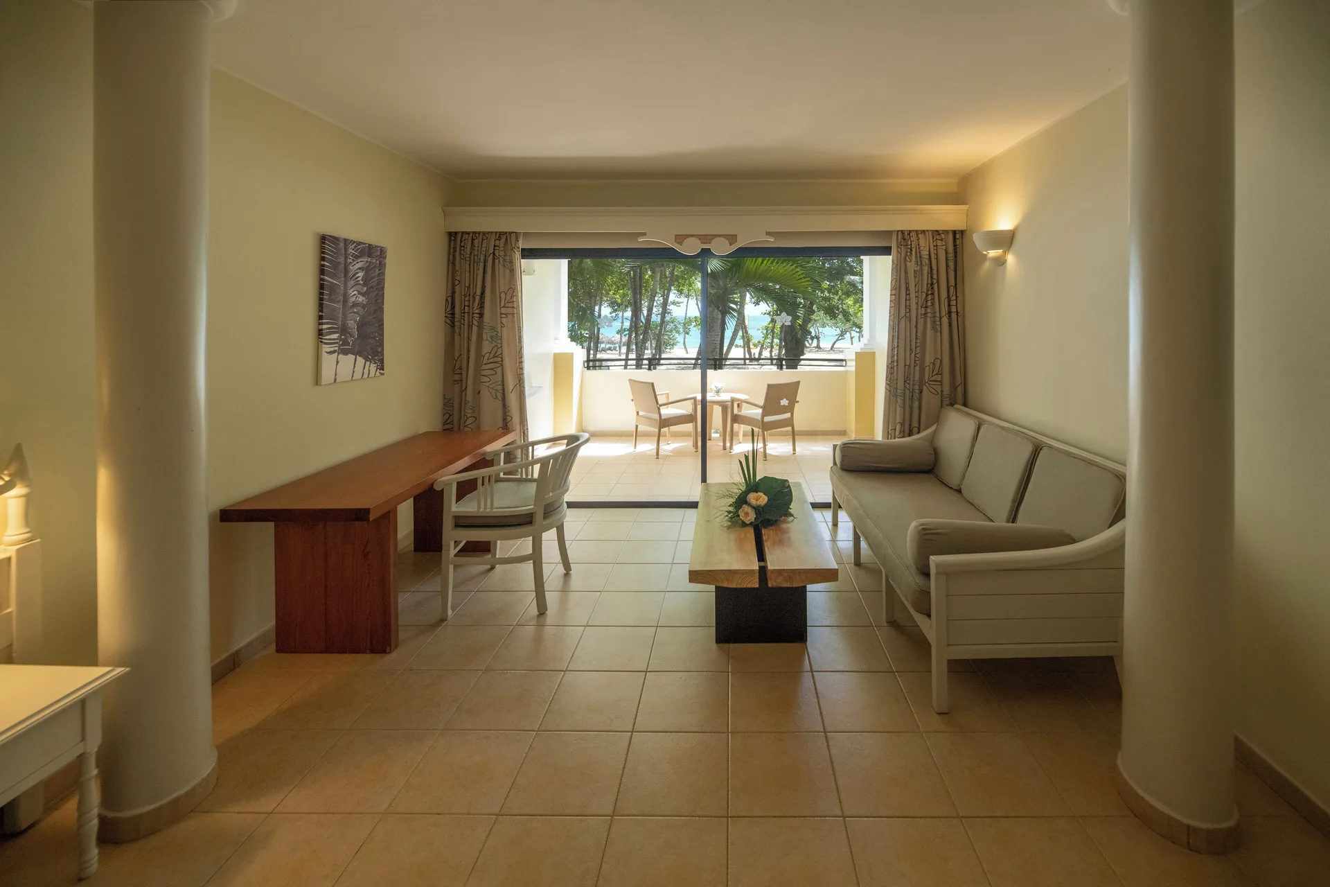 Junior Suite Oceanfront sitting area and balcony at Iberostar Waves Costa Dorada.