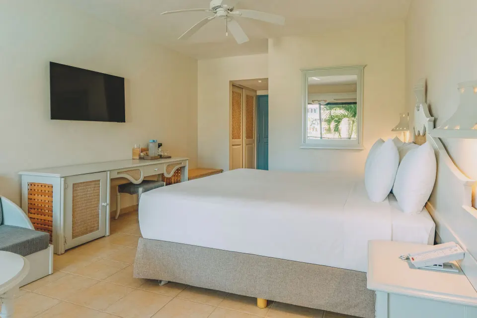 Premium Room Beachside with king bed and TV at Iberostar Waves Costa Dorada.