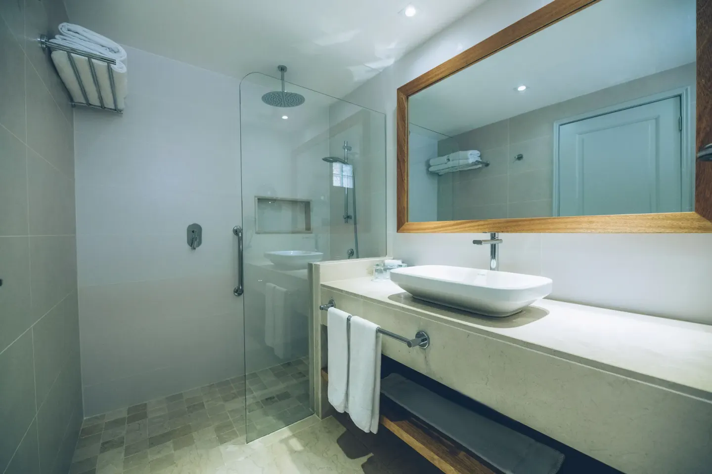 Premium Room Ocean View bathroom with shower and vanity at Iberostar Waves Costa Dorada.