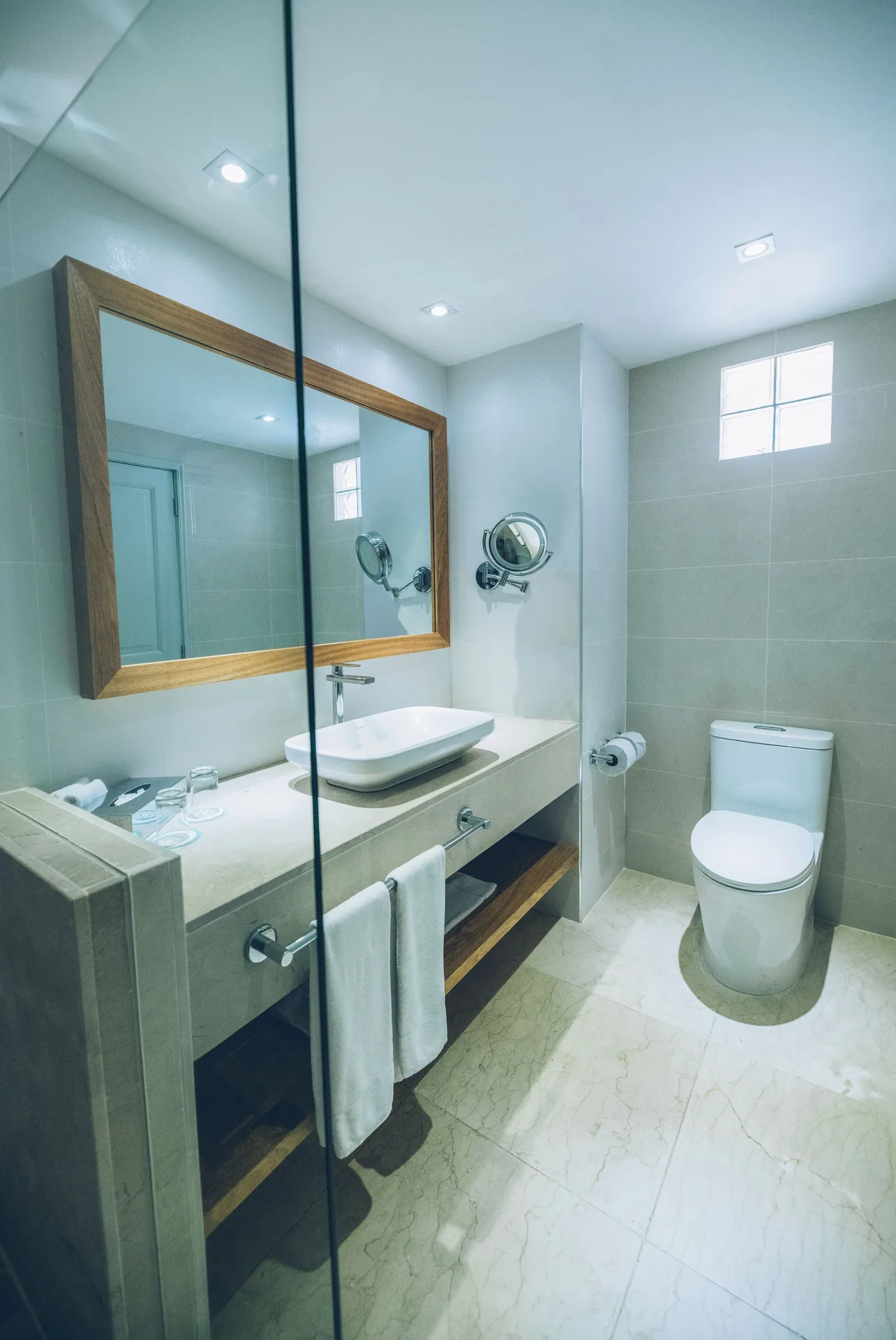 Premium Tropical View Room bathroom with vanity and toilet at Iberostar Waves Costa Dorada.