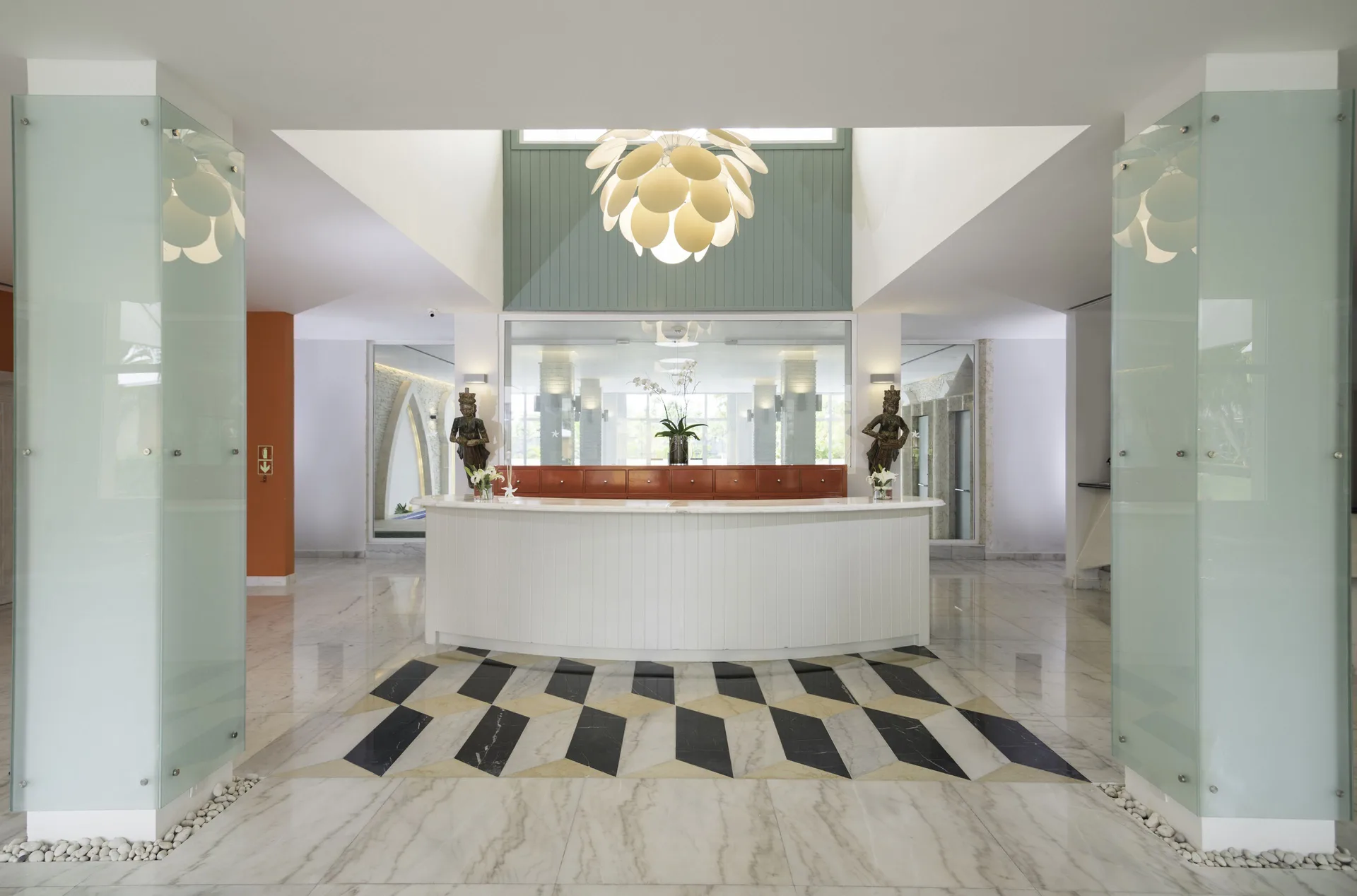 Bright lobby reception desk with marble floors at Iberostar Waves Dominicana.