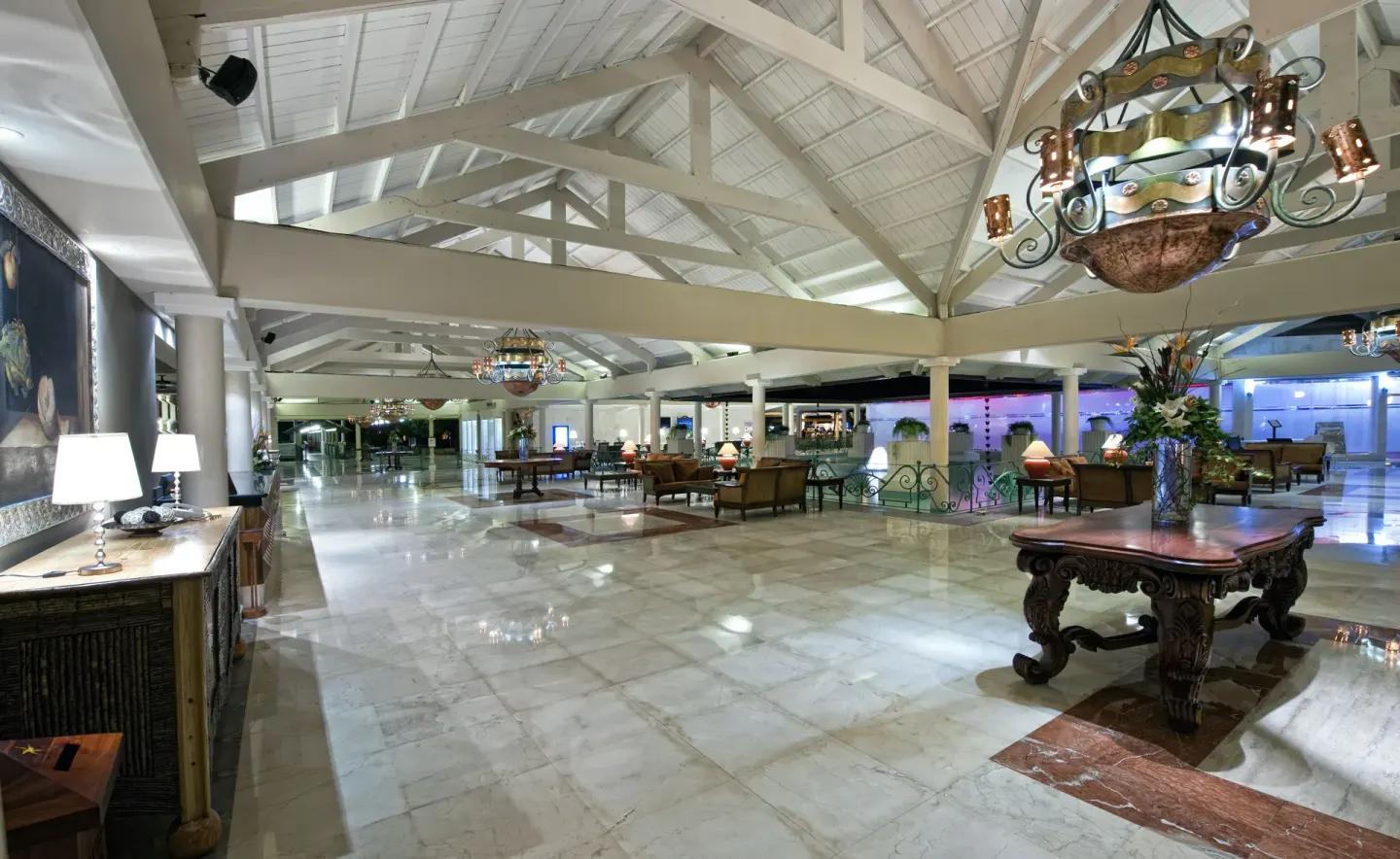 Open lobby with vaulted white ceiling and lounge seating at Iberostar Waves Dominicana.