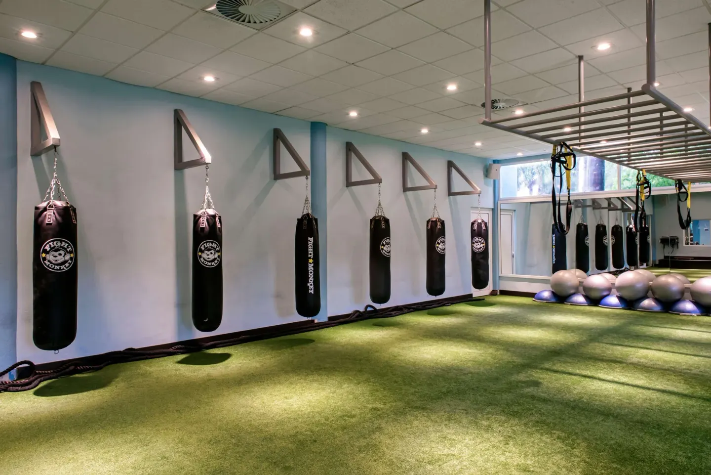 Training area with hanging punching bags at Iberostar Waves Paraíso Beach.