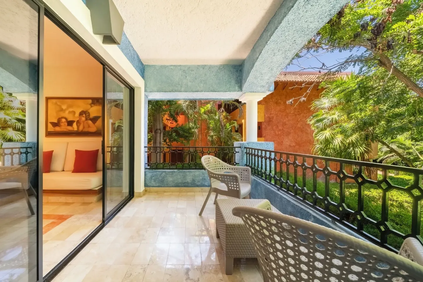 Junior Suite Beachside balcony with outdoor chairs at Iberostar Waves Paraíso Beach.