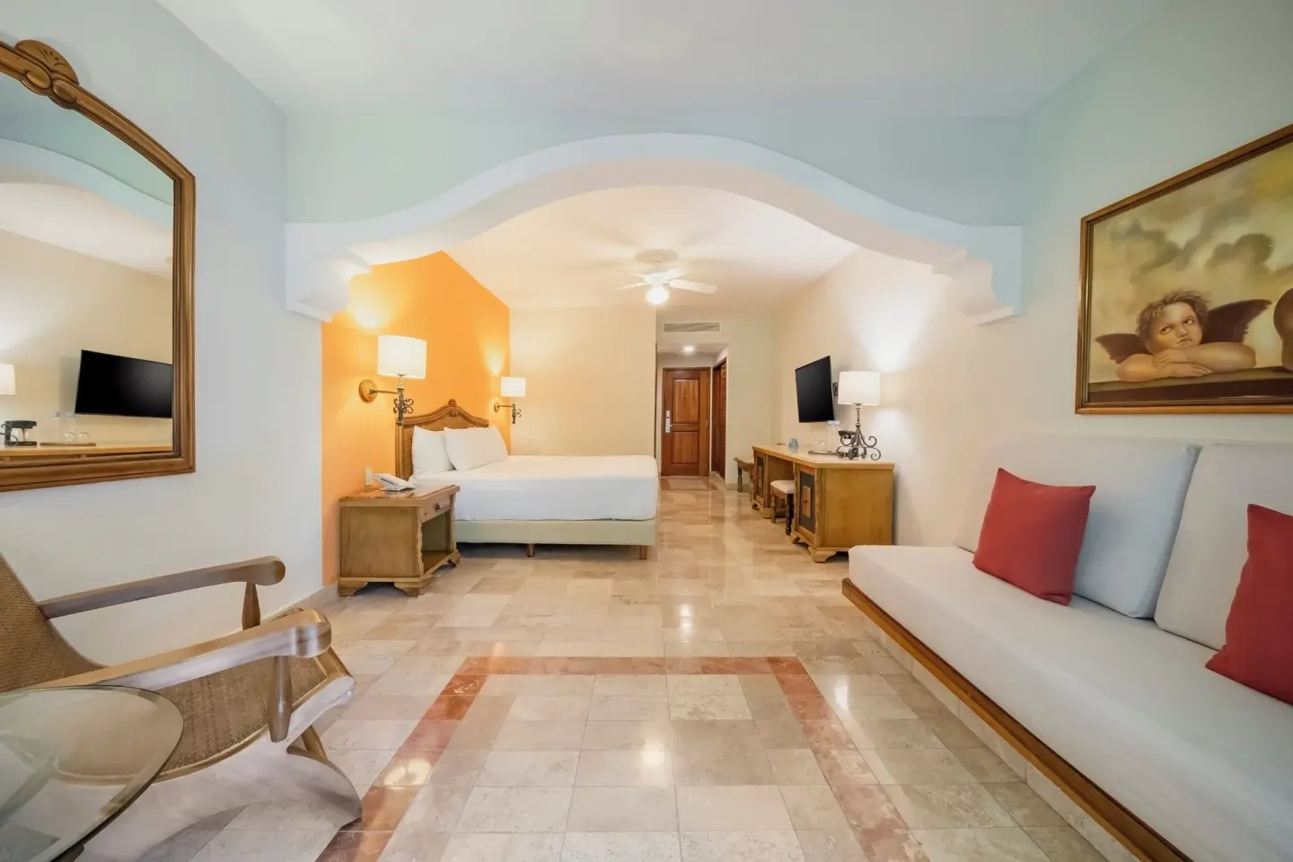 Junior Suite Beachside with king bed and sofa at Iberostar Waves Paraíso Beach.