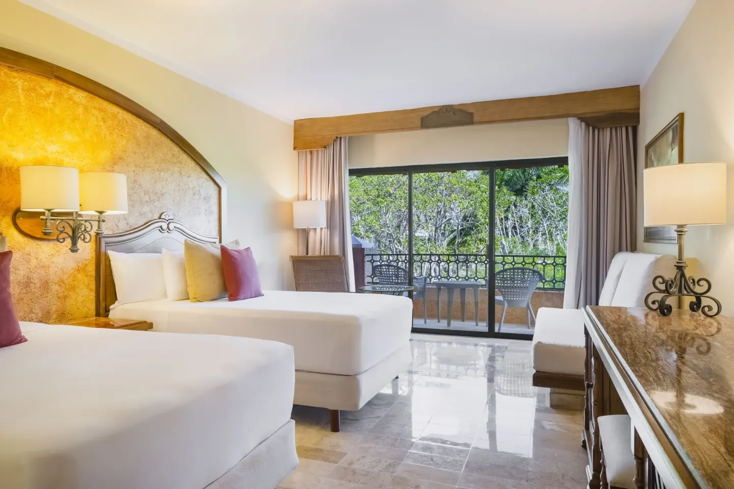 Premium Room with two beds and a balcony overlooking trees at Iberostar Waves Paraíso Beach.
