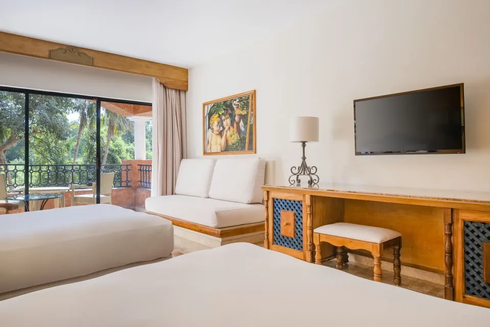 Premium Room with two beds, sofa, TV, and balcony at Iberostar Waves Paraíso Beach.