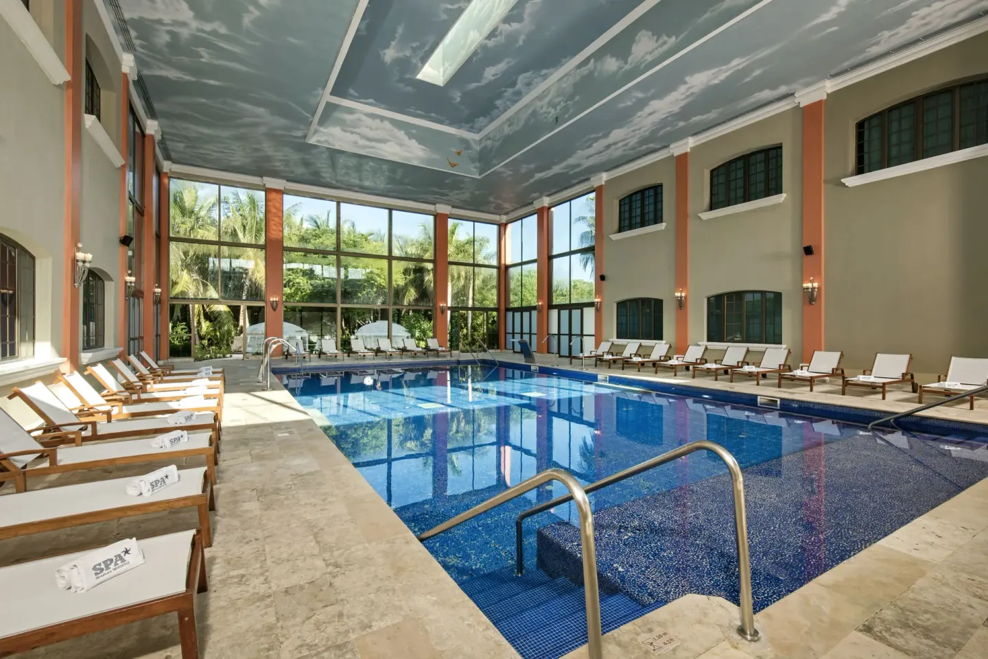 Large indoor spa pool with loungers at Iberostar Waves Paraíso del Mar.