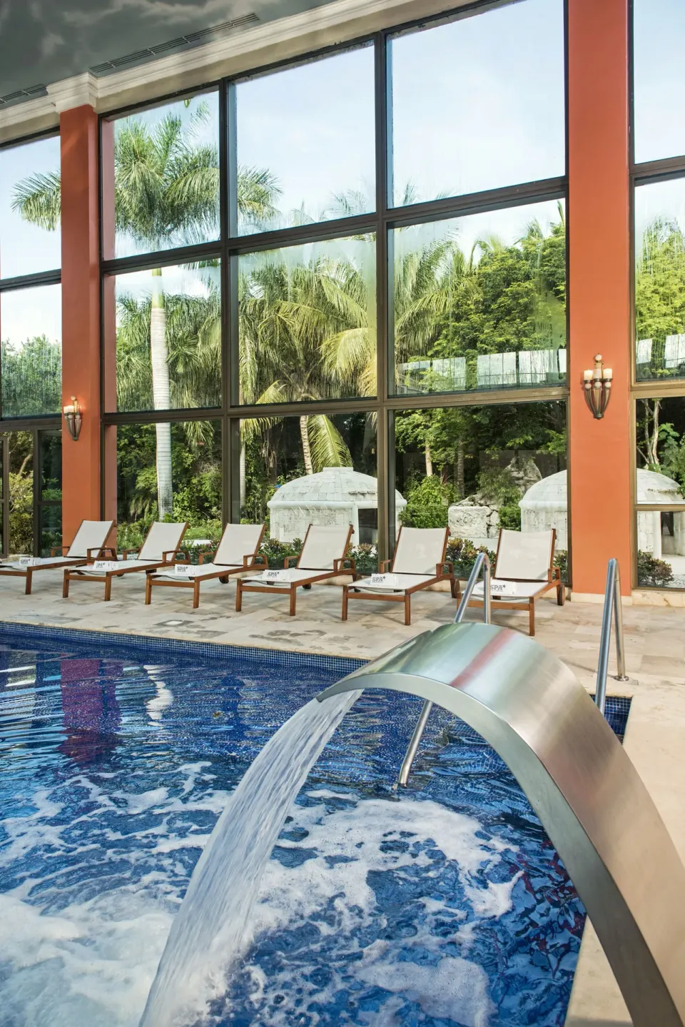 Spa pool water feature beside loungers at Iberostar Waves Paraíso del Mar.