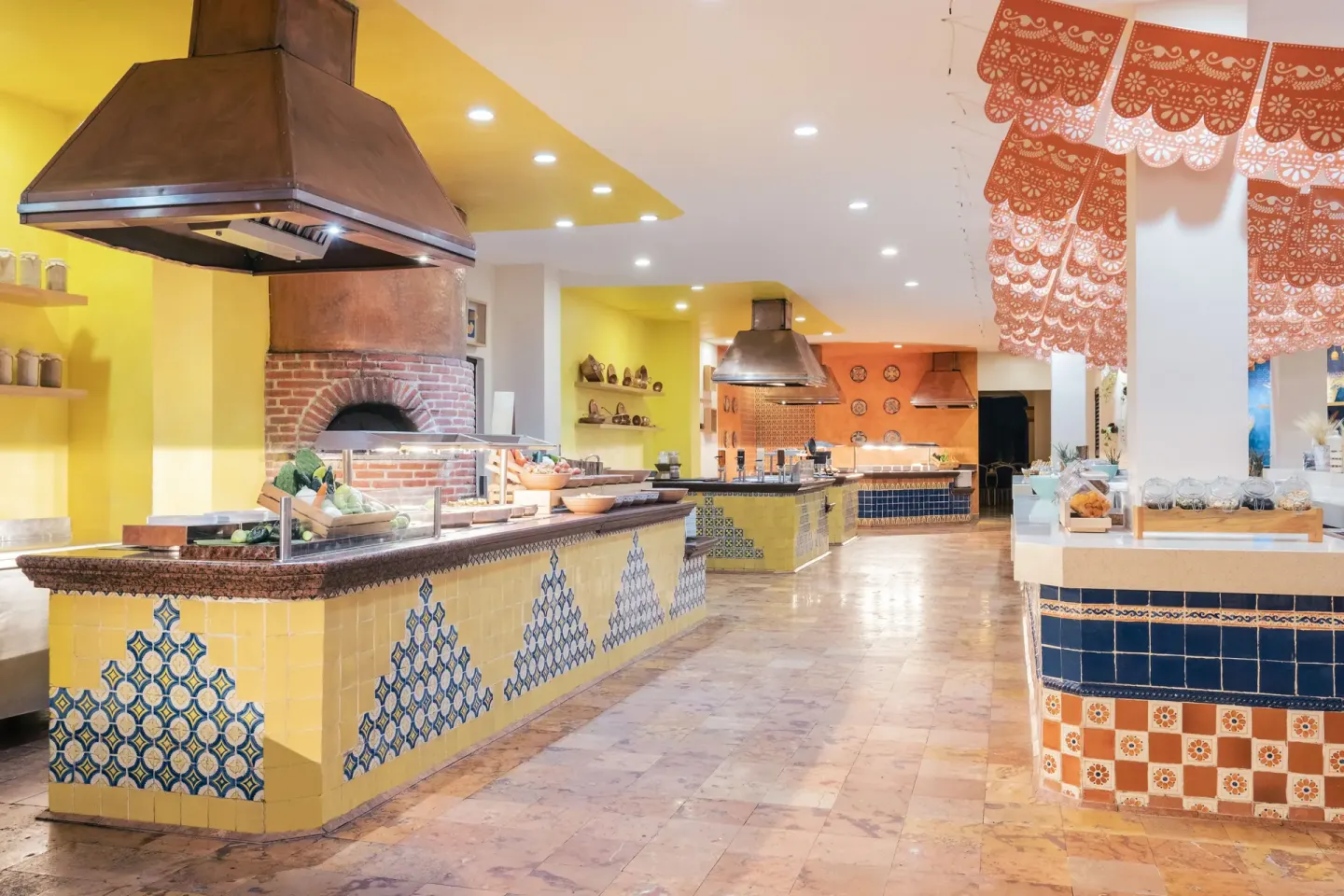 Colorful buffet counters with tiled stations at Iberostar Waves Paraíso del Mar.