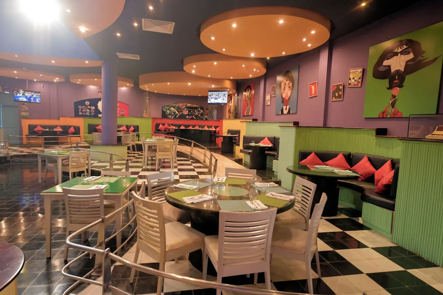 Colorful lounge seating and tables at Iberostar Waves Punta Cana.