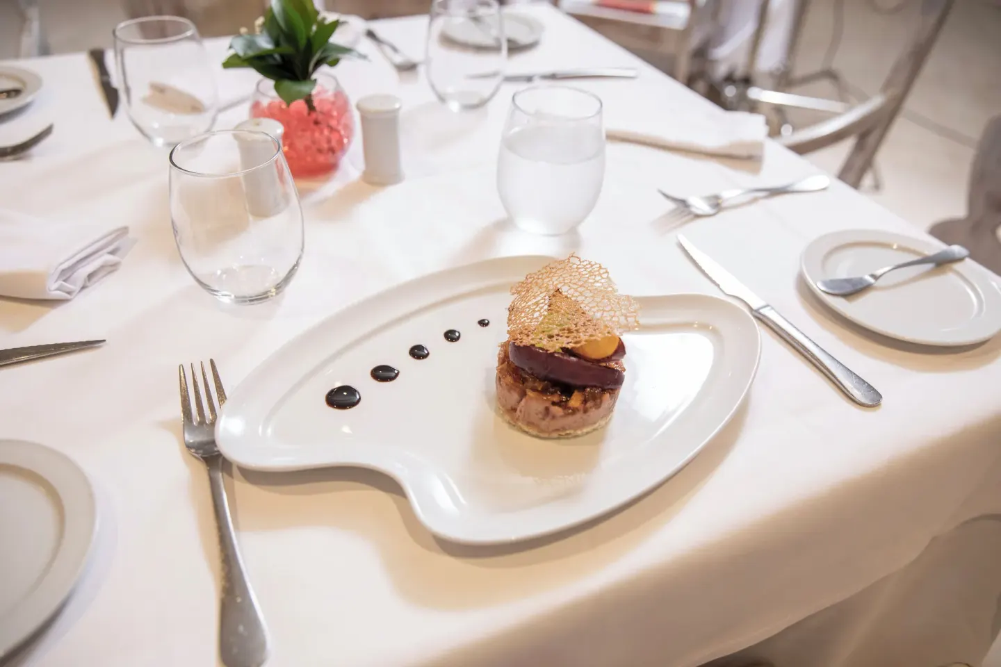 Plated appetizer on a white tablecloth at Iberostar Waves Punta Cana.