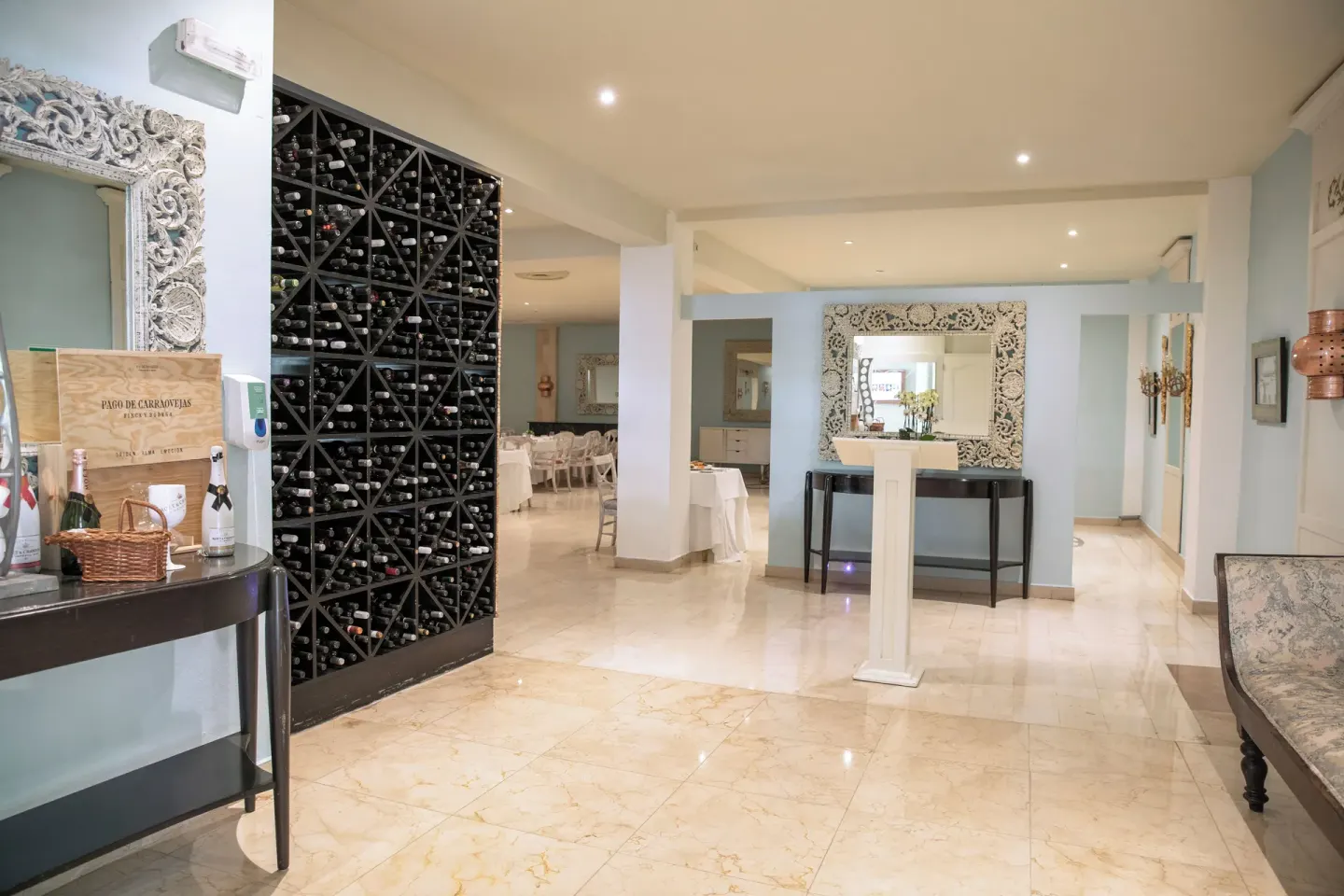 Wine display and polished dining entrance at Iberostar Waves Punta Cana.