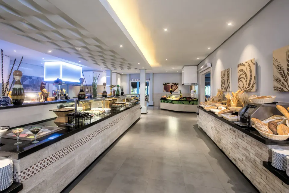 Wide buffet corridor with island stations and food displays at Iberostar Waves Tucán