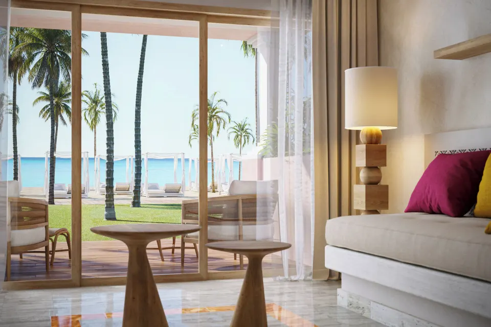 Junior Suite Oceanfront room interior with sliding doors to beach at Iberostar Waves Tucán
