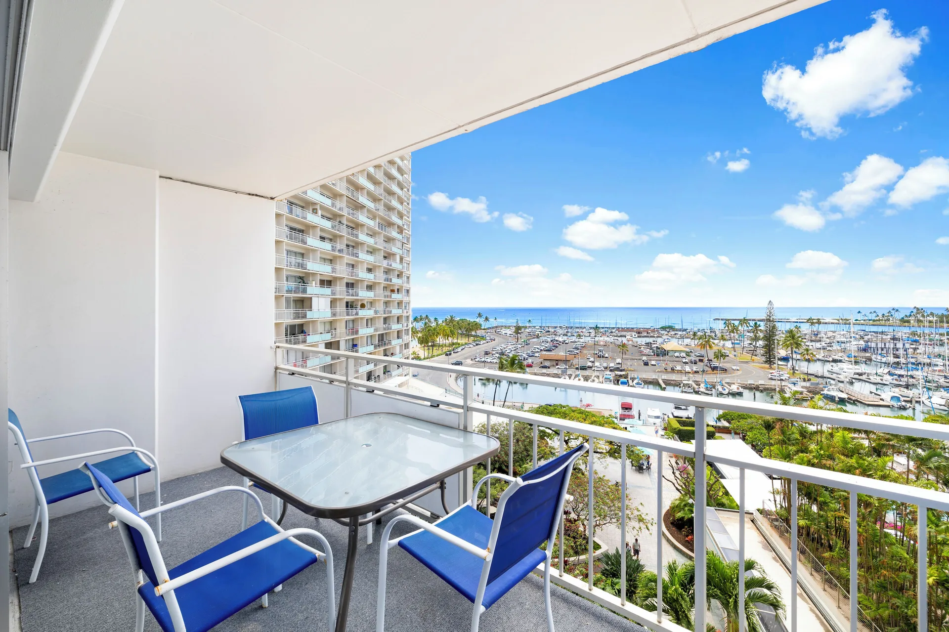 Corner lanai seating with marina and ocean view at Ilikai Hotel.