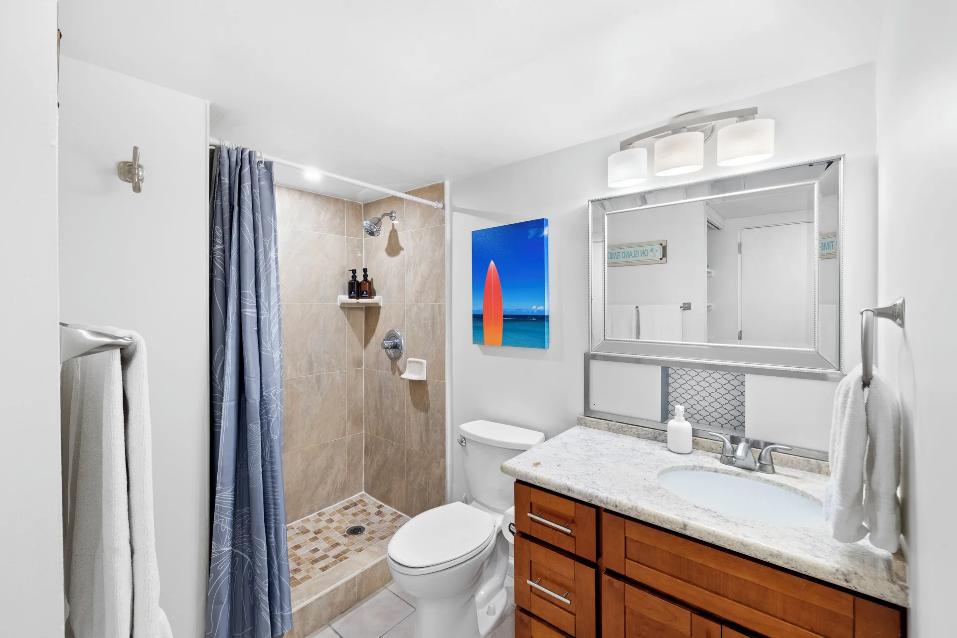 Standard Apartment Ocean View bathroom with shower and vanity at Ilikai Hotel.