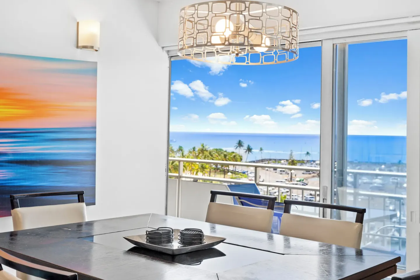 Dining table by sliding glass doors with ocean view at Ilikai Hotel.