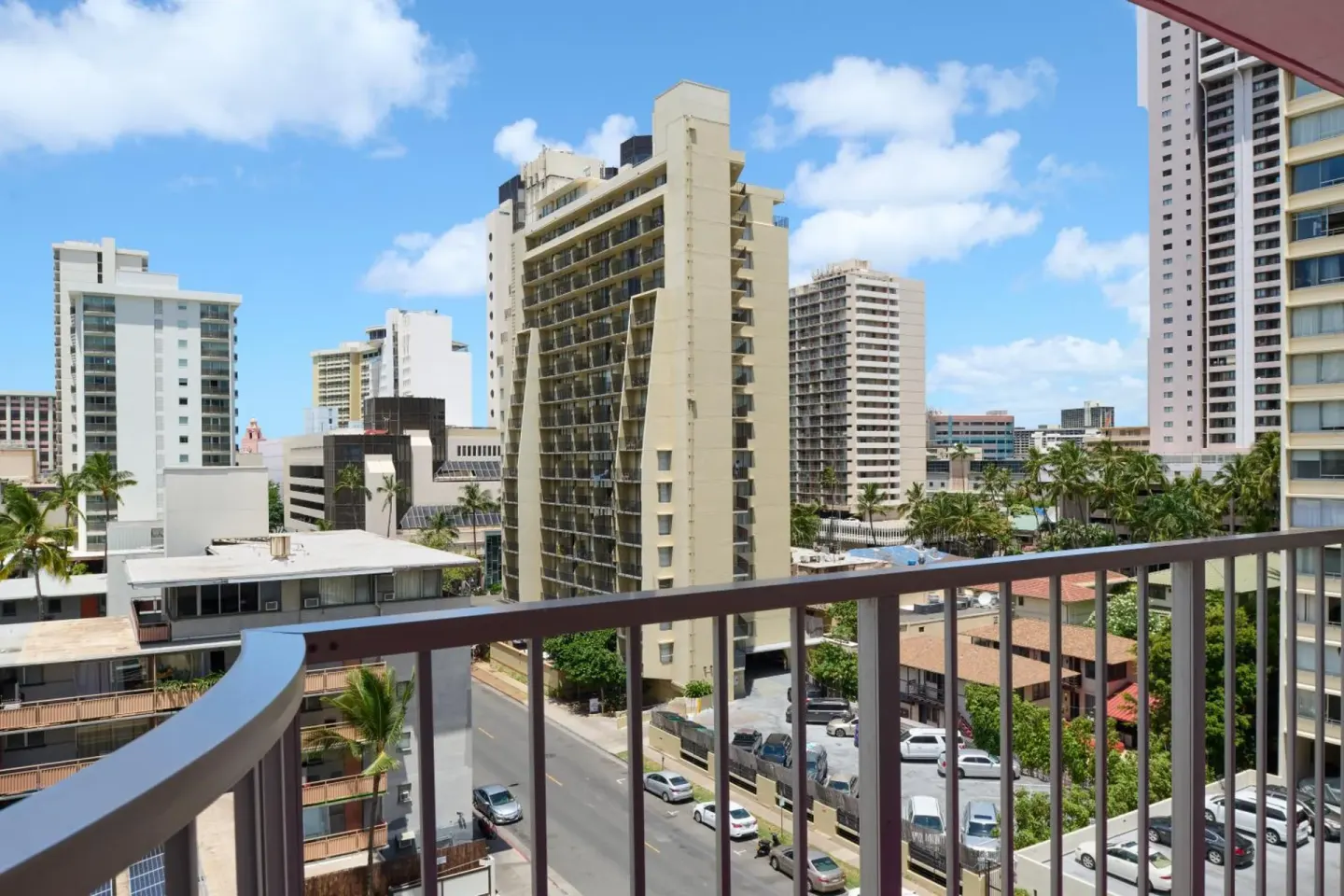 Balcony view of neighboring high-rises and streets near Ilima Hotel.