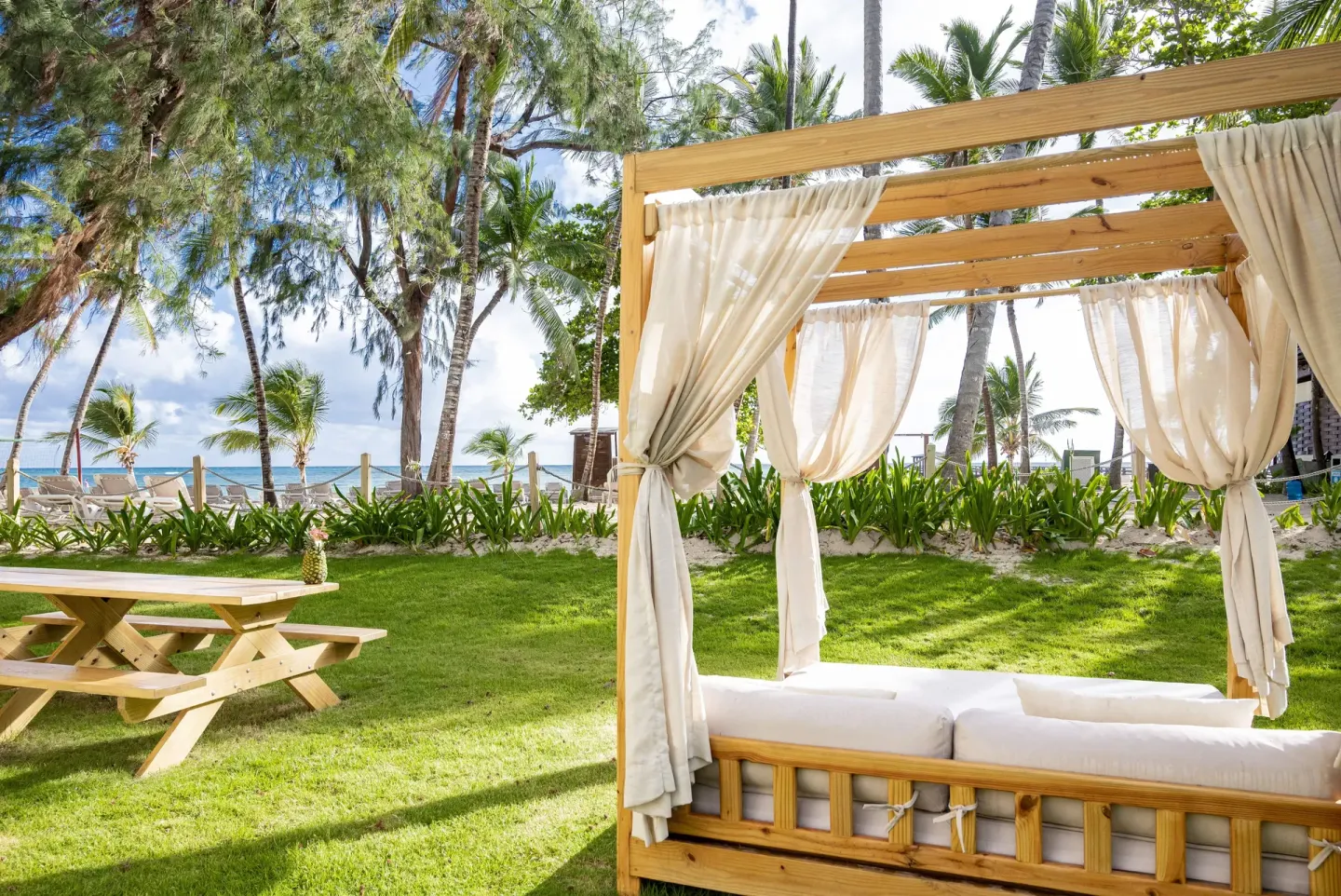 Beachside garden daybed and picnic table at Impressive Premium Punta Cana.