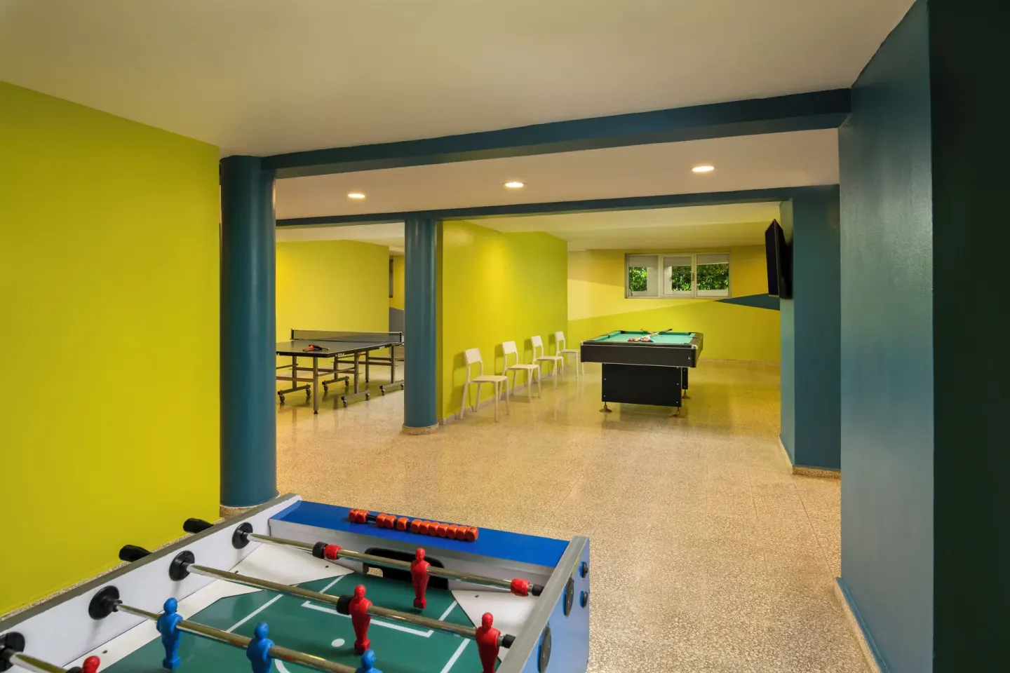Game room with foosball, ping-pong, and pool table at Impressive Premium Punta Cana.