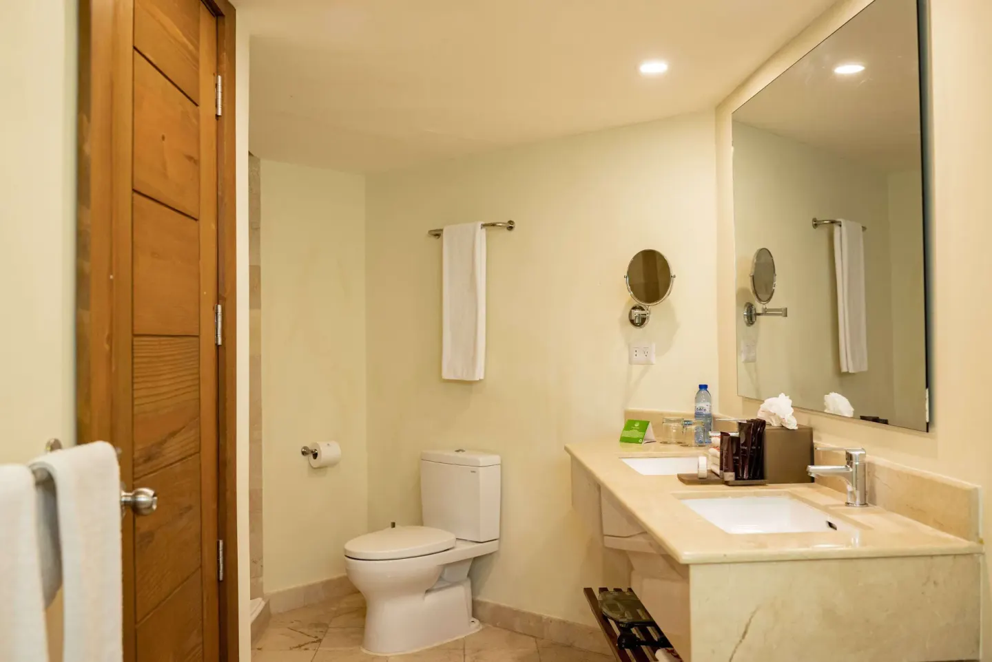 Guest bathroom with vanity and toilet at Impressive Premium Punta Cana.
