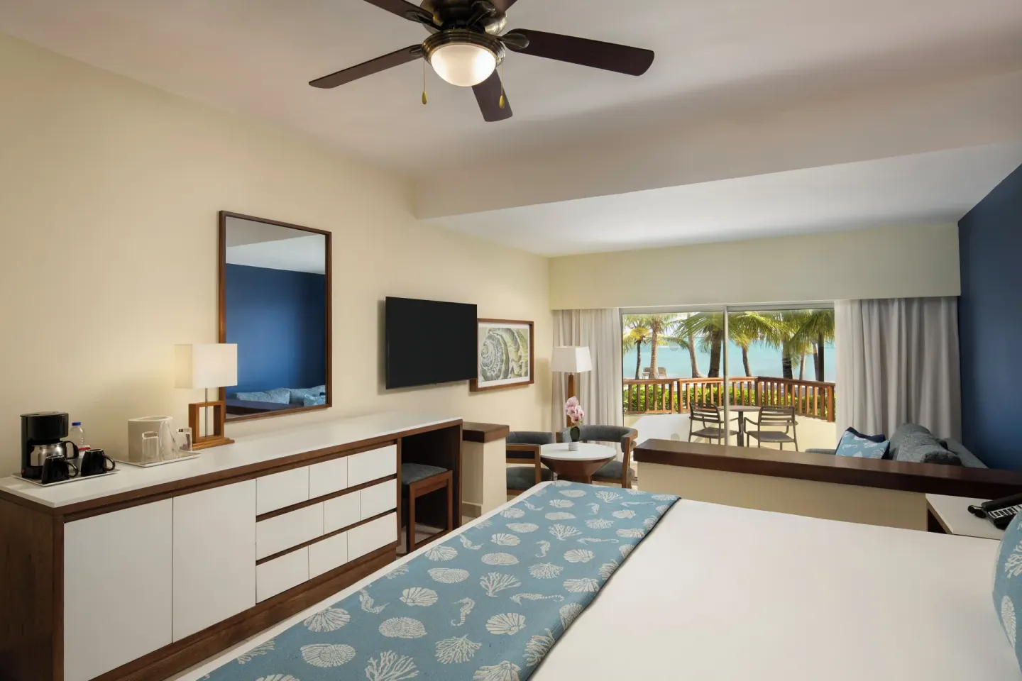 Guest room with king bed, balcony, and ocean view at Impressive Premium Punta Cana.