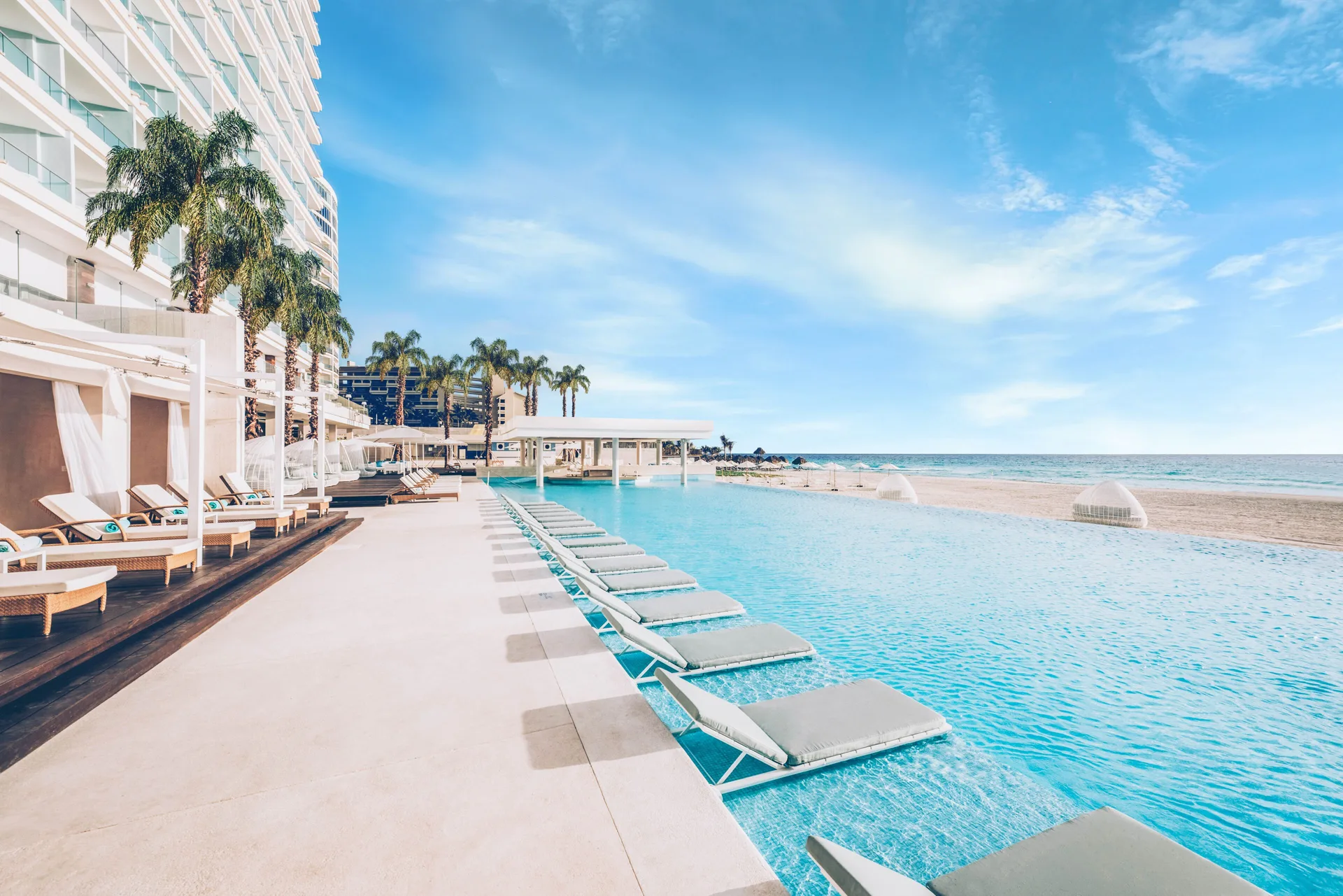 Iberostar Selection Coral Cancún adults-only all-inclusive resort with modern beachfront tower design