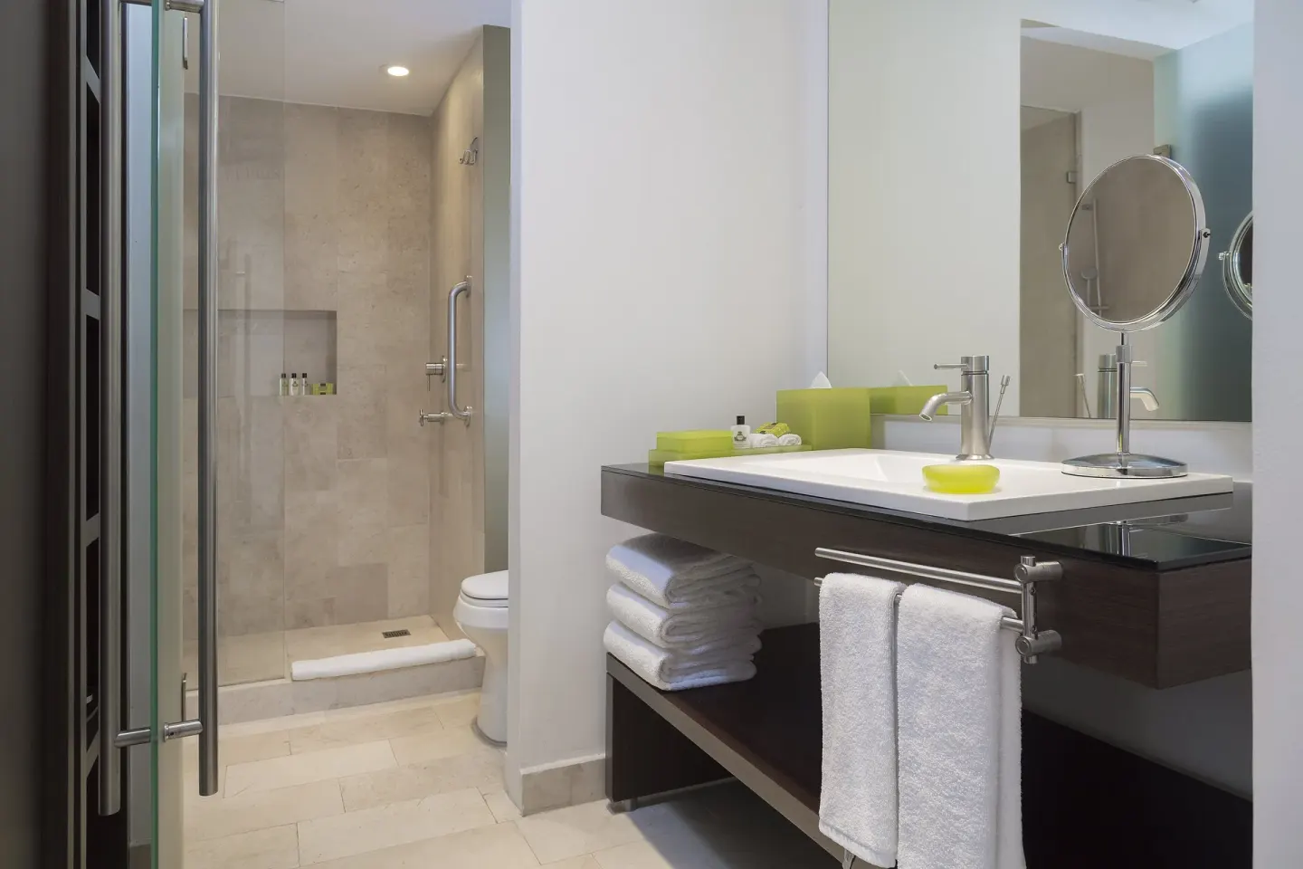 Bathroom vanity and walk-in shower at InterContinental Presidente Cancun Resort.